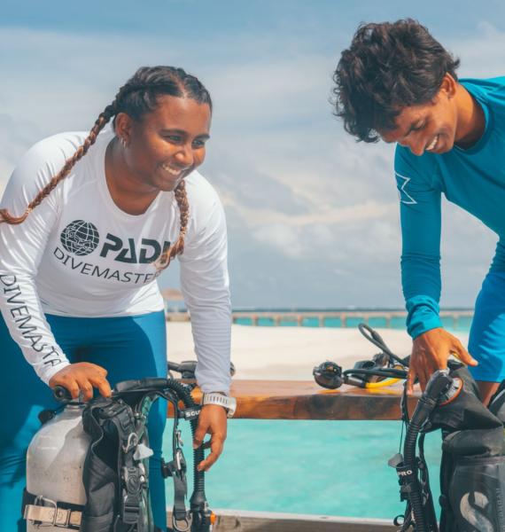 PADI Pros aiding fellow divers.