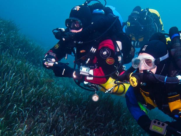 Diver with rebreathers
