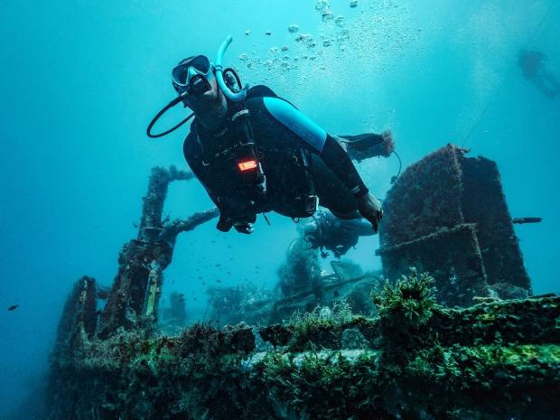 Advanced Open Water diver in ocean.
