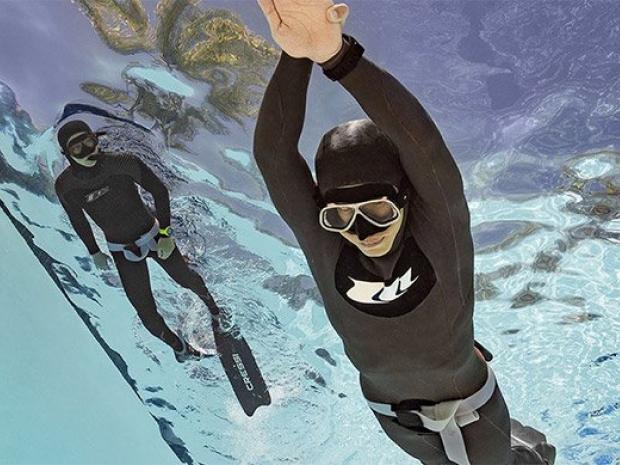 Freediver practicing in the pool